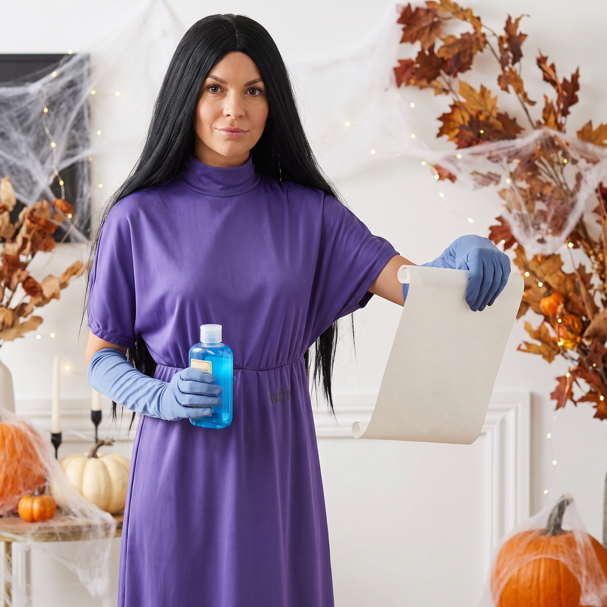 Woman wearing the grand purple witch costume