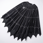 Detail of the spiderweb print and jagged hem