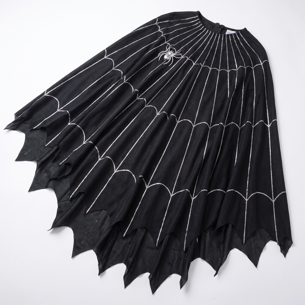 Detail of the spiderweb print and jagged hem