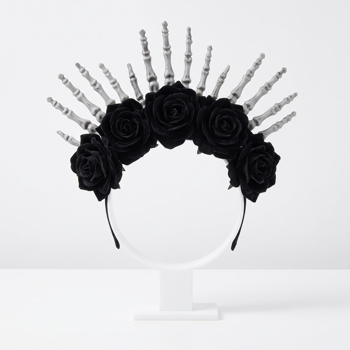 Skeleton hands headpiece on white background
