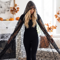 Woman wearing the midnight fiesta hooded lace cape