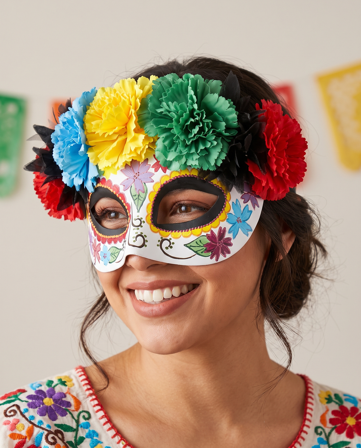 Woman wearing bright flower Day of the Dead eye mask