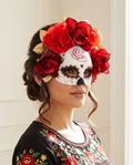 Woman wearing red and gold flower Day of the Dead eye mask