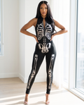 Woman wearing metallic bone skeleton jumpsuit