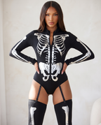 Woman wearing metallic bone skeleton bodysuit costume