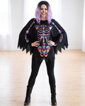 Woman wearing rainbow foil skeleton poncho