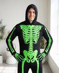 Man wearing green UV glow skeleton hooded jumpsuit
