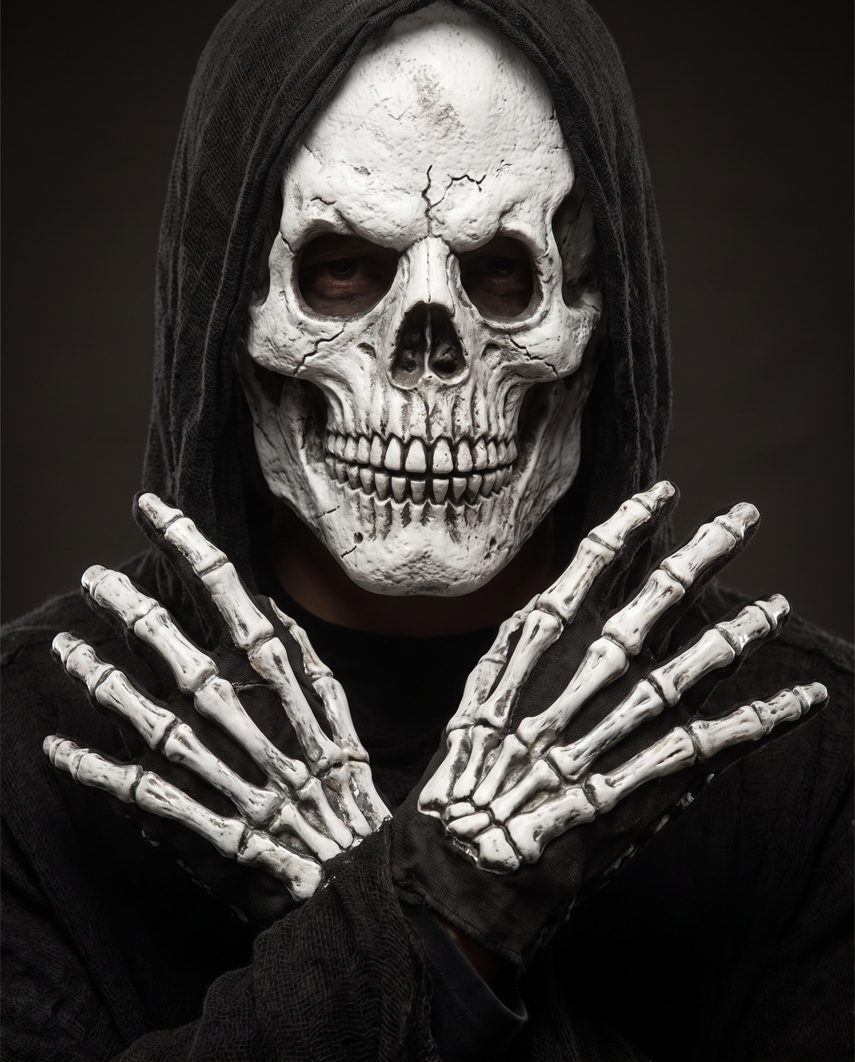 Detail of skull mask and skeleton gloves