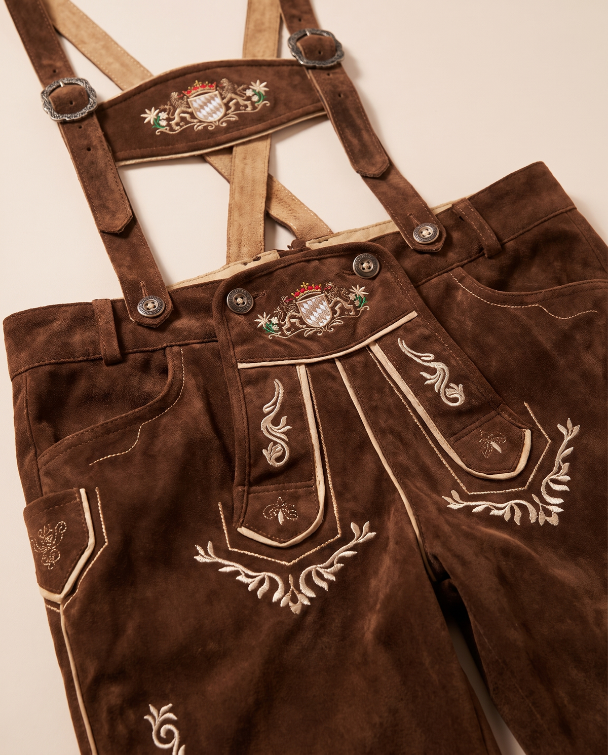 Detail of lederhosen embroidery and suspenders