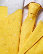 Detail of yellow beer print jacket and tie